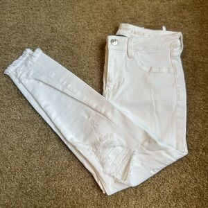 American Eagles Next Level Stretch White Distressed Mid-Rise Jegging